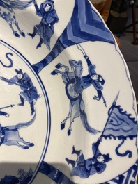Three large deep Chinese blue and white 'hunting scene' dishes, Chenghua mark, Kangxi