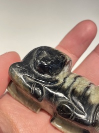 Five Chinese white, celadon and grey-black jade carvings, Qing/Republic