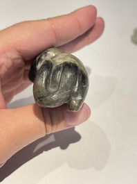 Five Chinese white, celadon and grey-black jade carvings, Qing/Republic
