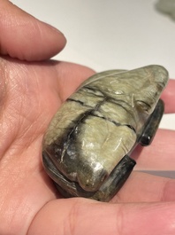 Five Chinese white, celadon and grey-black jade carvings, Qing/Republic