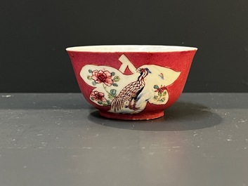 A Chinese famille rose ruby-pink-ground 'pheasants' cup and saucer, Yongzheng