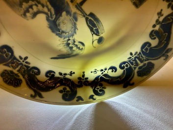 A pair of Chinese eggshell Pronk studio 'parrot and spaniel' plates, Yongzheng/Qianlong
