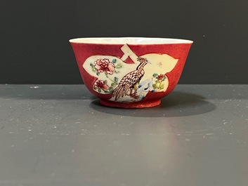 A Chinese famille rose ruby-pink-ground 'pheasants' cup and saucer, Yongzheng