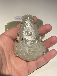 Three Chinese celadon and white jade pendants, Qing