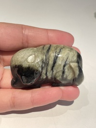 Five Chinese white, celadon and grey-black jade carvings, Qing/Republic