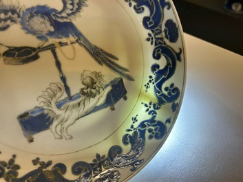A pair of Chinese eggshell Pronk studio 'parrot and spaniel' plates, Yongzheng/Qianlong