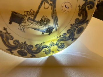A pair of Chinese eggshell Pronk studio 'parrot and spaniel' plates, Yongzheng/Qianlong