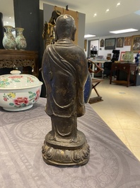 A Chinese gilt bronze standing Buddha, Ming