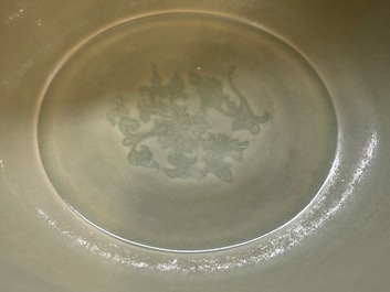 A Chinese Longquan celadon bowl with underglaze floral design, Ming
