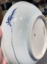 A Chinese blue and white dish with a scholar in a landscape, Yongzheng/Qianlong