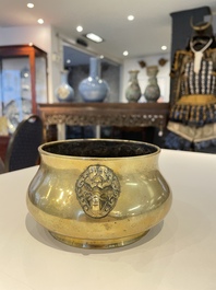 A Chinese bronze elephant-head-handled censer, Xuande mark, Kangxi/Qianlong