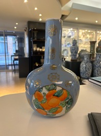 A Chinese lavender blue-ground bottle vase with fruit medallions, Republic