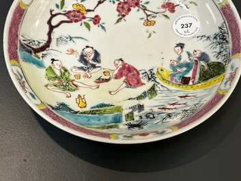 A Chinese famille rose plate and bowl with a nursing mother and men drinking tea on the shore, Yongzheng