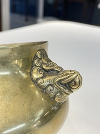 A Chinese bronze elephant-head-handled censer, Xuande mark, Kangxi/Qianlong