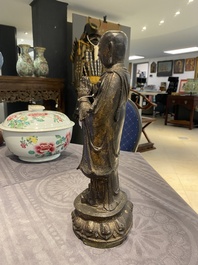 A Chinese gilt bronze standing Buddha, Ming
