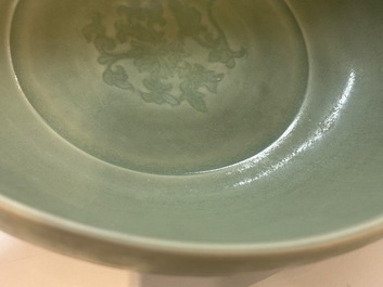 A Chinese Longquan celadon bowl with underglaze floral design, Ming
