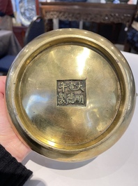 A Chinese bronze elephant-head-handled censer, Xuande mark, Kangxi/Qianlong