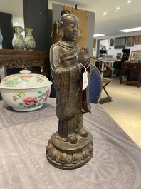A Chinese gilt bronze standing Buddha, Ming
