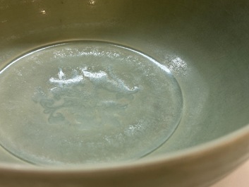 A Chinese Longquan celadon bowl with underglaze floral design, Ming