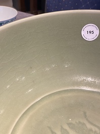 A Chinese Longquan celadon bowl with underglaze floral design, Ming