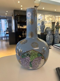 A Chinese lavender blue-ground bottle vase with fruit medallions, Republic