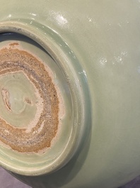 A Chinese Longquan celadon bowl with underglaze floral design, Ming