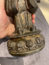 A Chinese gilt bronze standing Buddha, Ming