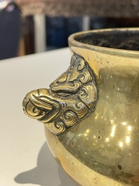 A Chinese bronze elephant-head-handled censer, Xuande mark, Kangxi/Qianlong