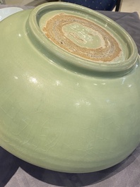 A Chinese Longquan celadon bowl with underglaze floral design, Ming