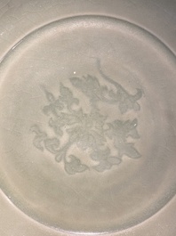 A Chinese Longquan celadon bowl with underglaze floral design, Ming