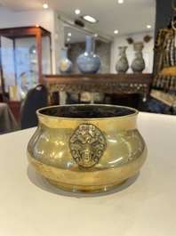 A Chinese bronze elephant-head-handled censer, Xuande mark, Kangxi/Qianlong