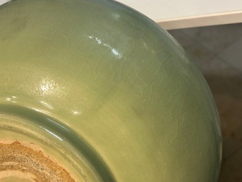 A Chinese Longquan celadon bowl with underglaze floral design, Ming
