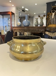 A Chinese bronze elephant-head-handled censer, Xuande mark, Kangxi/Qianlong