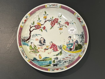 A Chinese famille rose plate and bowl with a nursing mother and men drinking tea on the shore, Yongzheng