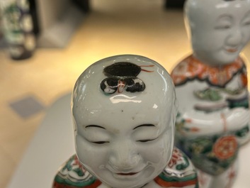 A pair of Chinese famille verte 'Hehe Er Xian' figures, Kangxi