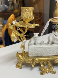A Chinese Dehua blanc de Chine joss stick holder with French gilt bronze candlestick mounts, Kangxi and 18/19th C.