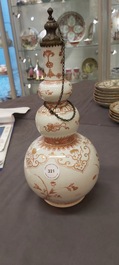 A Chinese iron-red and gilt-decorated triple gourd vase, Kangxi
