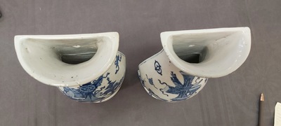 A pair of Chinese blue and white wall pocket vases with antiquities, Kangxi