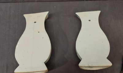 A pair of Chinese blue and white wall pocket vases with antiquities, Kangxi