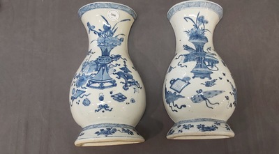 A pair of Chinese blue and white wall pocket vases with antiquities, Kangxi