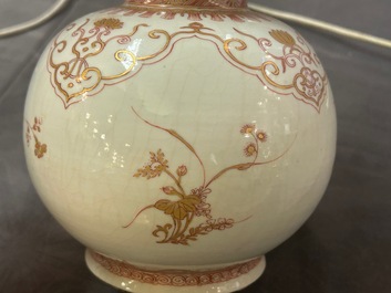 A Chinese iron-red and gilt-decorated triple gourd vase, Kangxi
