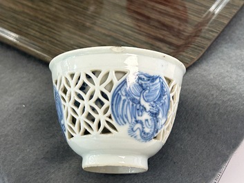 A rare Chinese reticulated double-walled blue and white 'phoenix' cup, Kangxi