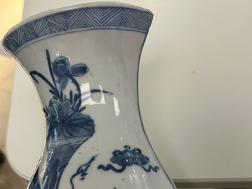 A pair of Chinese blue and white wall pocket vases with antiquities, Kangxi
