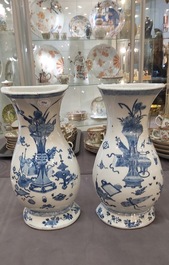 A pair of Chinese blue and white wall pocket vases with antiquities, Kangxi