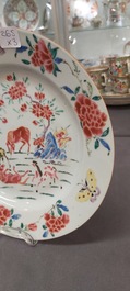 A Chinese famille rose dish and two plates, Yongzheng/Qianlong
