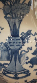 A pair of Chinese blue and white wall pocket vases with antiquities, Kangxi