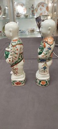 A pair of Chinese famille verte 'Hehe Er Xian' figures, Kangxi