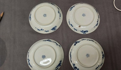 Nine Chinese blue and white 'Madonna and Child' saucers and two cups, Kangxi