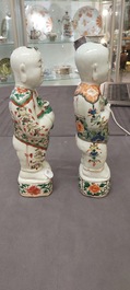 A pair of Chinese famille verte 'Hehe Er Xian' figures, Kangxi