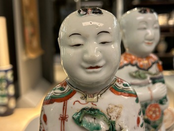 A pair of Chinese famille verte 'Hehe Er Xian' figures, Kangxi